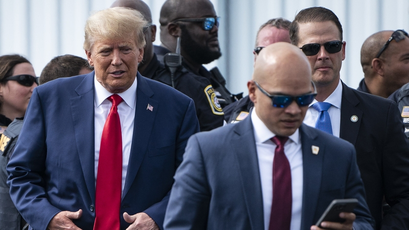 Walt Nauta walks ahead of Donald Trump on route to the Georgia Republican Party's state convention last month