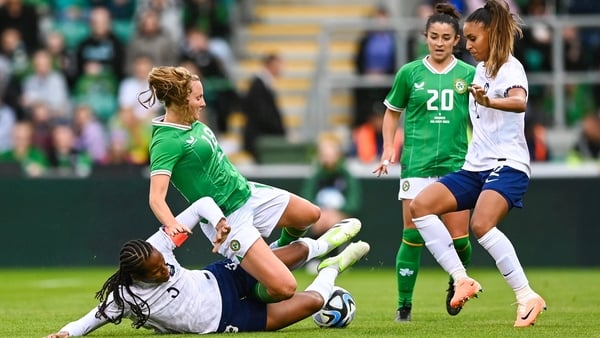 Kyra Carusa is tackled by Elisa De Almeida