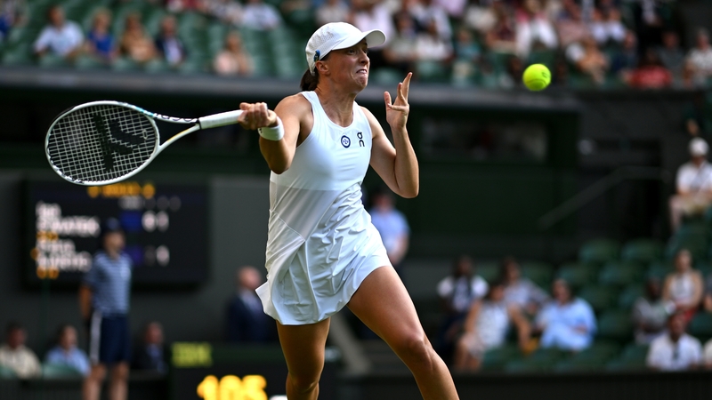 Iga Swiatek unleashes a forehand against Petra Martic