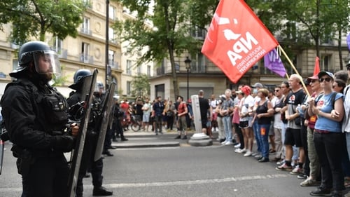 Demonstrators march in Paris in memory of victims of police violence