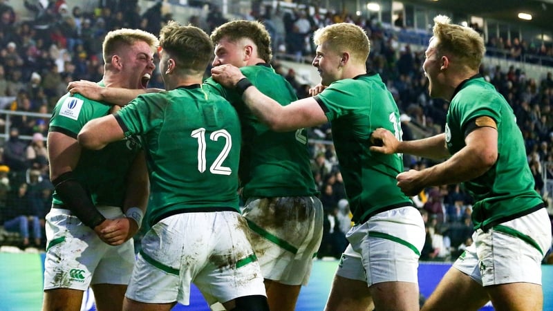 Sam Berman (left) celebrates Ireland's fourth try with his team-mates