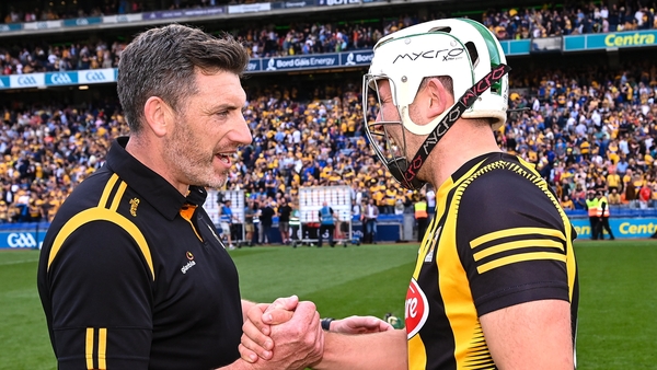 Derek Lyng savours the win with Pádraig Walsh