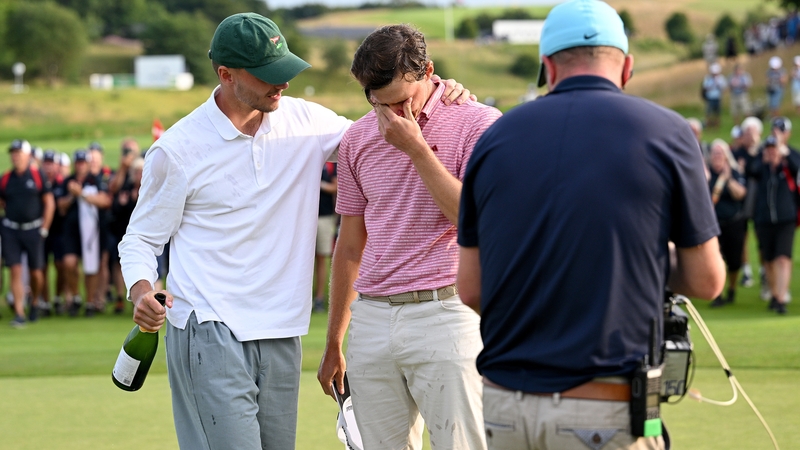 Rasmus Hojgaard is congratulated by his brother Nicolai