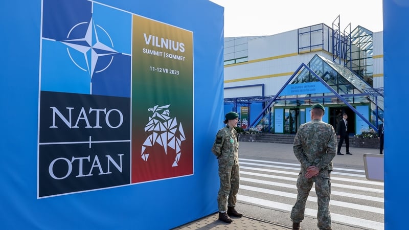 Military personnel stand on guard on the opening day of the annual NATO Summit in Vilnius, Lithuania