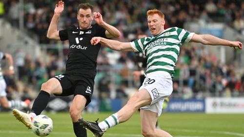 Rory Gaffney gets his shot away despite the efforts of Viktor Orn Margeirsson