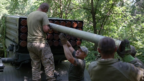 Ukrainian artillerymen load missiles onto rocket launcher near Bakhmut, Donetsk