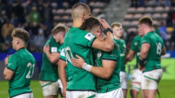 Sam Prendergast (left) consoles a teammate after the final whistle