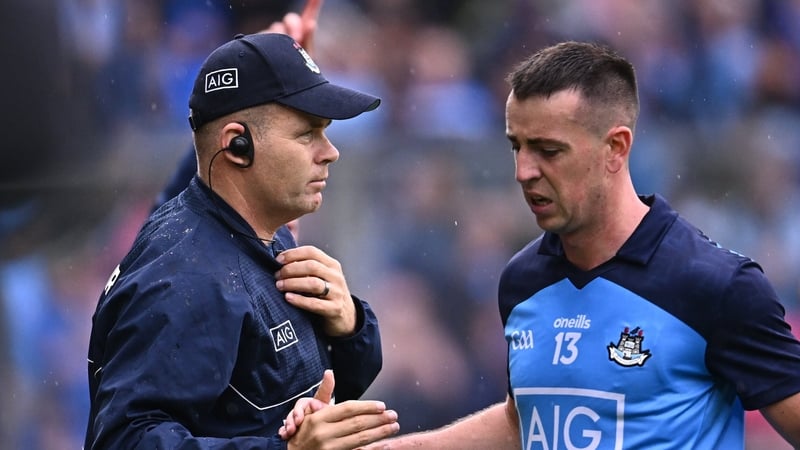 Cormac Costello (R) and Dublin manager Dessie Farrell after the forward was withdrawn late on at Croke Park