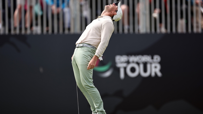 Rory McIlroy celebrates his birdie at the last to win the tournament