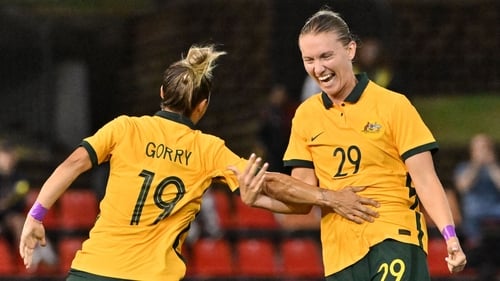 Clare Hunt (R) with Australia midfielder Katrina Gorry