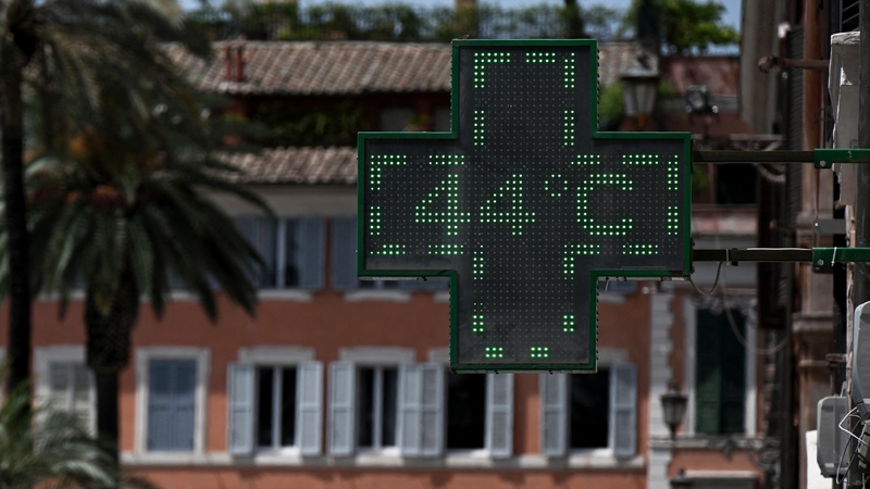 A pharmacy's sign indicates the outside temperature in Rome last week. Photo: Getty Images