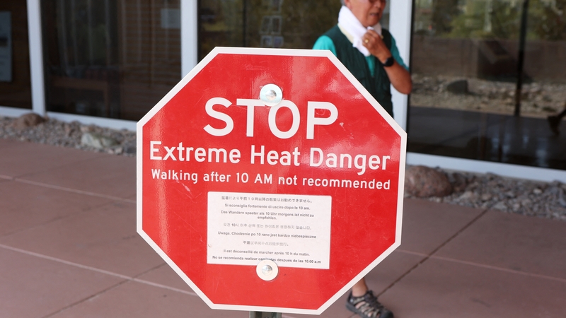 A heat advisory sign is shown at Furnace Creek Visitor Center during a heatwave in Death Valley National Park, California