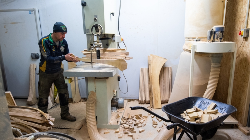 Stephen Dowling shapes a hurley with a bandsaw at The Star Hurleys in Jenkinstown, Co Kilkenny. Photo: Ramsey Cardy/Sportsfile via Getty Images