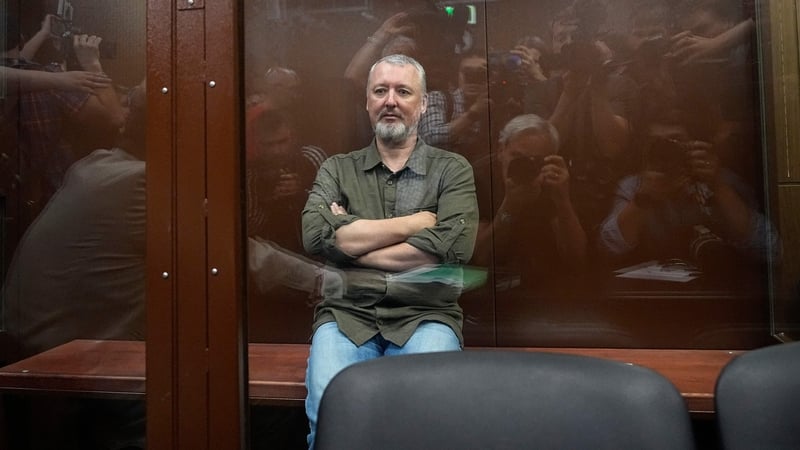 Igor Girkin sits inside a glass defendants' cage during a hearing to consider a request on his pre-trial arrest in Moscow