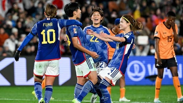 Riko Ueki celebrates after scoring a re-taken penalty to make it 5-0