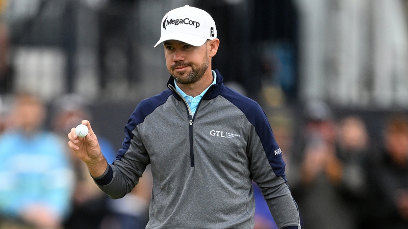 Brian Harman has one hand on the Claret Jug