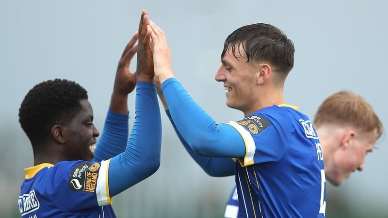 Waterford's Samuel Perry, right, is congratulated by team-mate Serge Atakayi after scoring his side's second goal