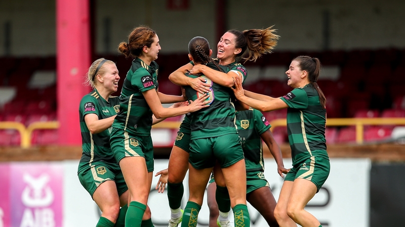 Gemma McGuinness surrounded by her team-mates after scoring the winning goal