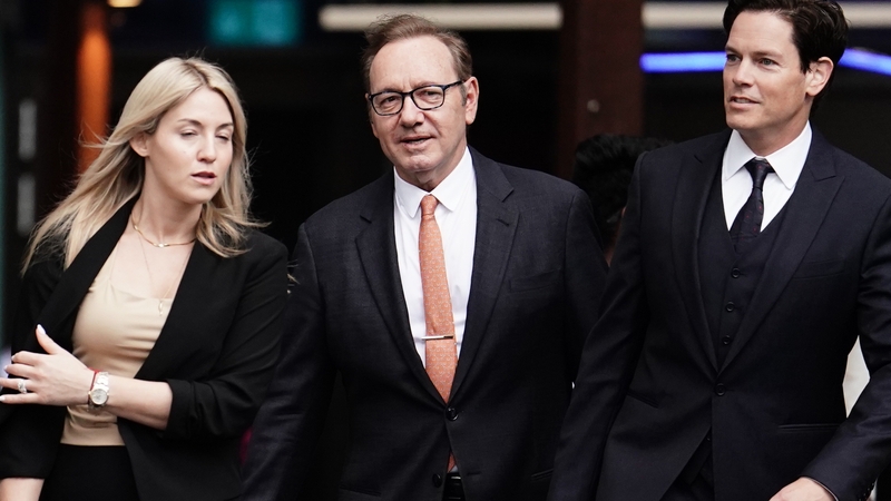 Kevin Spacey pictured centre arriving to Southwark Crown Court