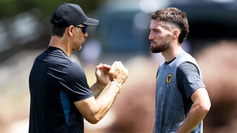 Matt Doherty speaks with Julen Lopetegui during Wolves' pre-season training camp in Lagos, Portugal