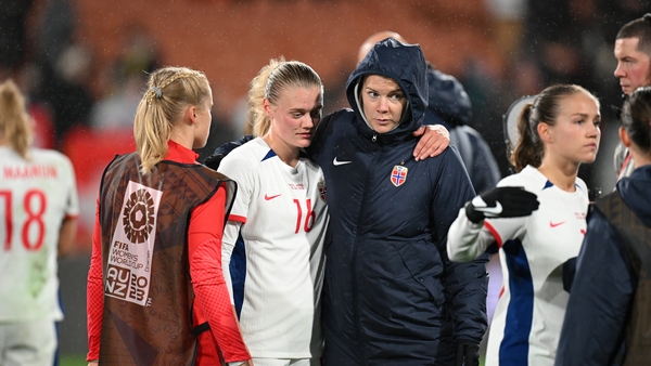Mathilde Harviken of Norway is consoled by the injured Ada Hegerberg