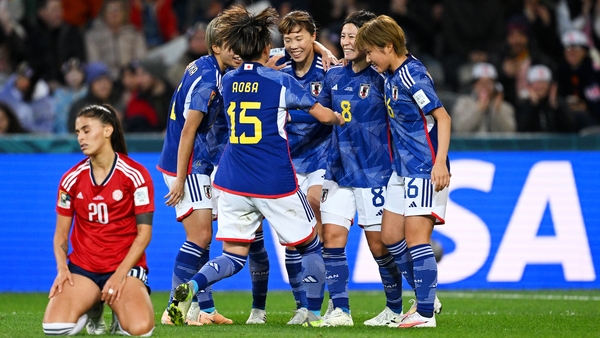 Japan celebrate their second goal