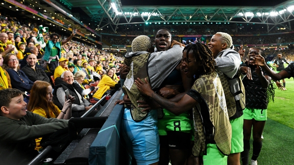Asisat Oshoala is mobbed after her goal