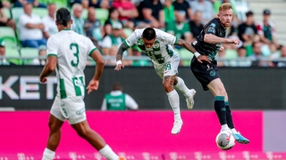 Cristian Ramirez and Sean Hoare compete for the ball