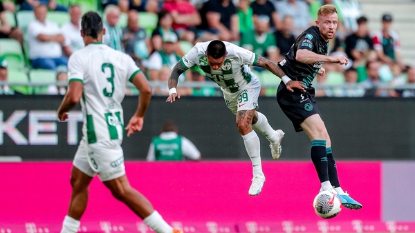 Cristian Ramirez and Sean Hoare compete for the ball