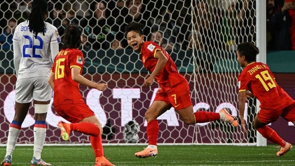 Wang Shuang (C) celebrates scoring the winner