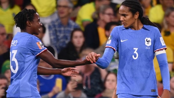 Wendie Renard (R) celebrates scoring with team-mate Vicki Becho