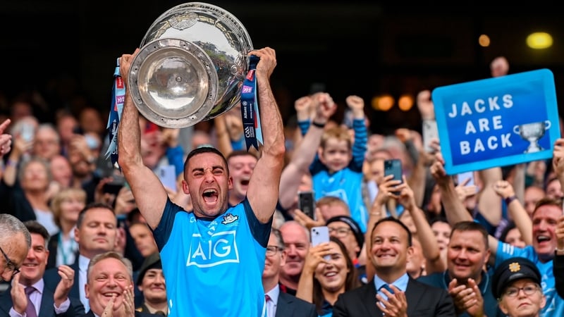 An ecstatic James McCarthy hoists the Sam Maguire Cup aloft