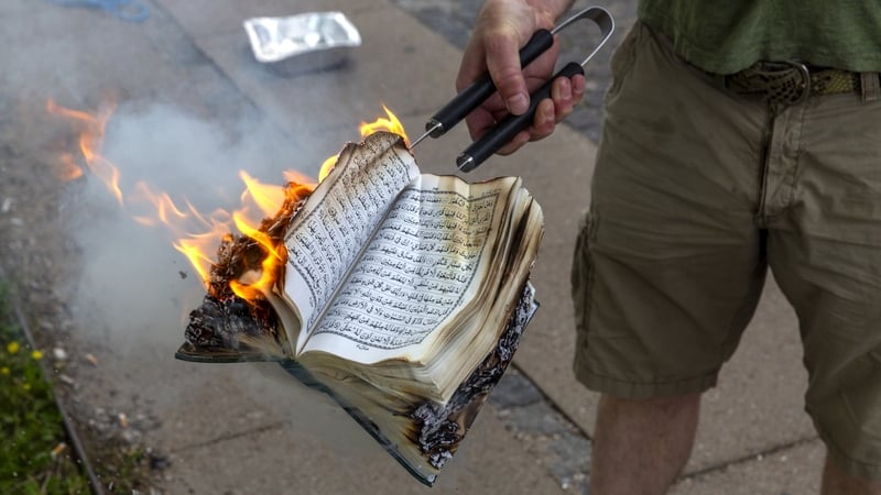 A Quran is burned by an activist from the small right-wing group, Danish Activists, on 28 July in Copenhagen, Denmark
