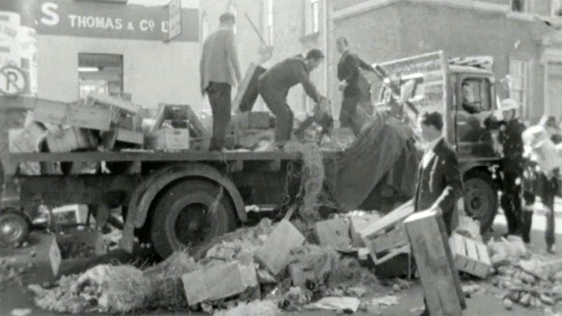 Dublin Corporation Workers throw rubbish across the street in protest, 1968