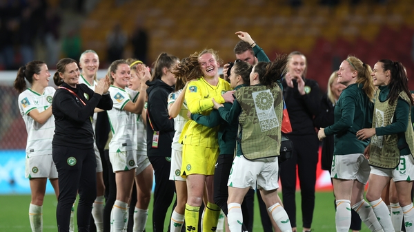 Courtney Brosnan is congratulated by her team-mates and staff after the final whistle