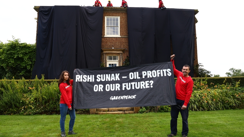 Campaigners draped the house with black fabric