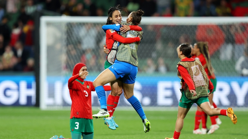 Morocco players celebrate advancing to the knockout stage after defeating Colombia