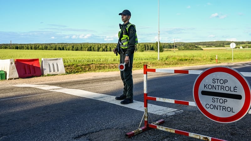 A Lithuanian border guard officer stands on a checkpoint next to the Lithuania-Belarus border (File pic)