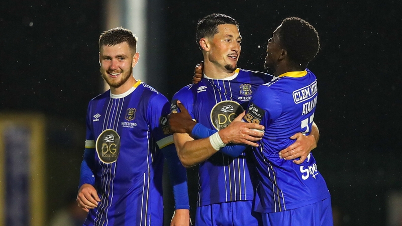 Ronan Coughlan, centre, celebrates after scoring Waterford's third goal