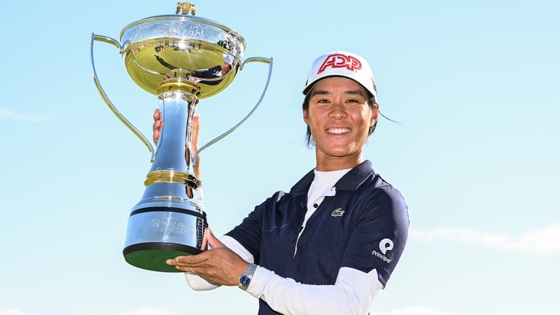 Celine Boutier poses with the championship trophy