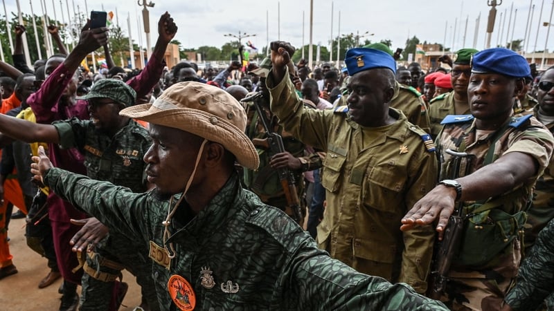 Niger's National Council for the Safeguard of the Homeland Colonel-Major Amadou Abdramane (2nd R) is greeted by supporters