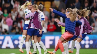 England celebrate after Chloe Kelly slots home the winning spot-kick in the penalty shootout