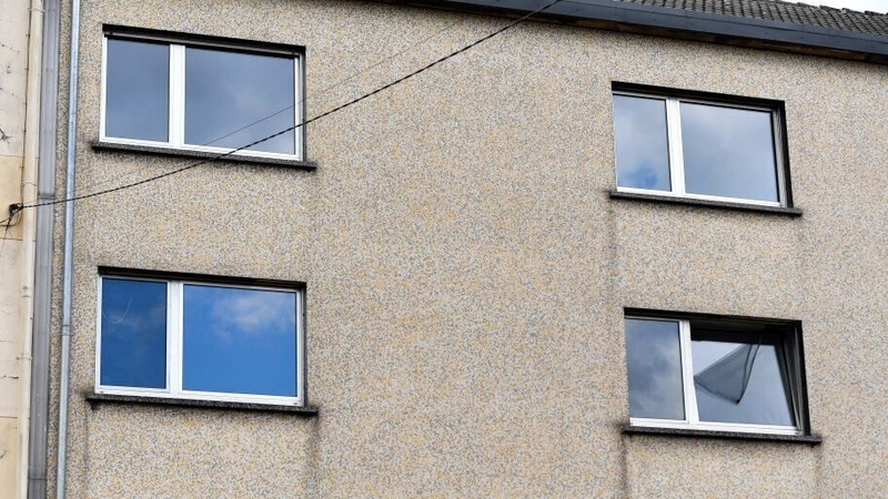 Two windows (bottom) of the couple's flat in eastern France