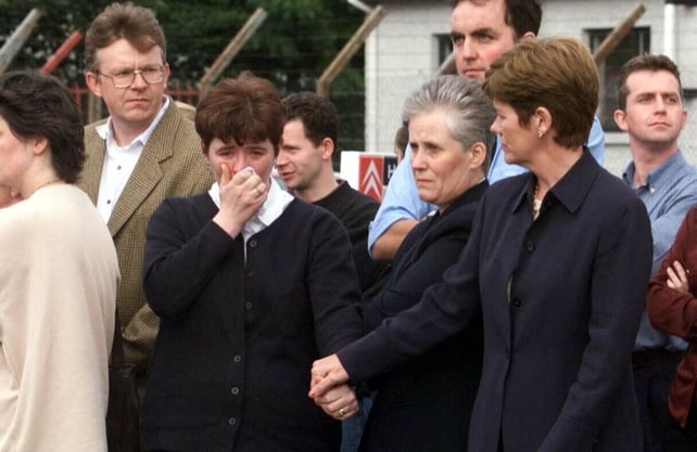 Relatives look on as the coffins of Avril Monaghan and her daughter Maura leave Omagh barracks for their funeral at St McCartan's Church. Mrs Monaghan and her mother Mary Grimes were leaving a shop when the bomb went off