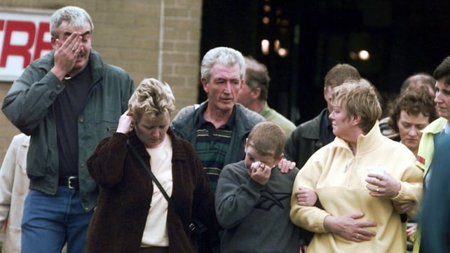 Omagh locals express their grief the day after the blast, in which 29 people were killed