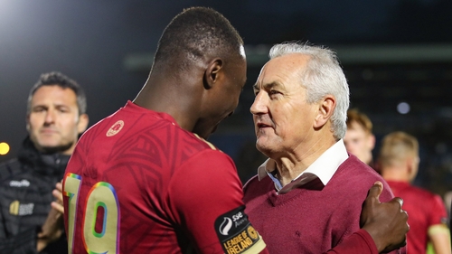 Galway United manager John Caulfield celebrates with Francely Lomboto after the game