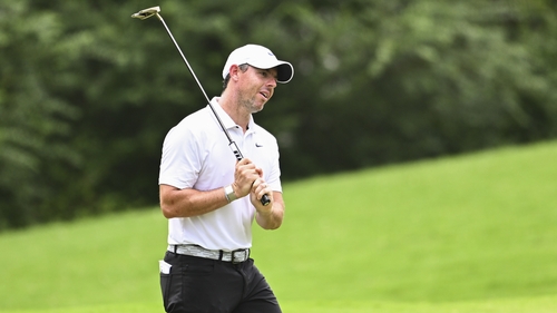 McIlroy reacts to a missed putt on the eighth