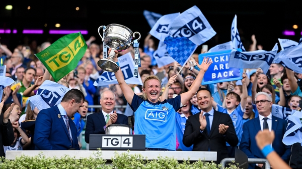 Carla Rowe, the Dublin captain, lifts the Brendan Martin Cup