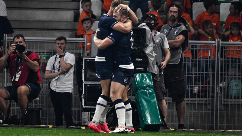 Scotland's wing Kyle Steyn (r) celebrates after scoring a try