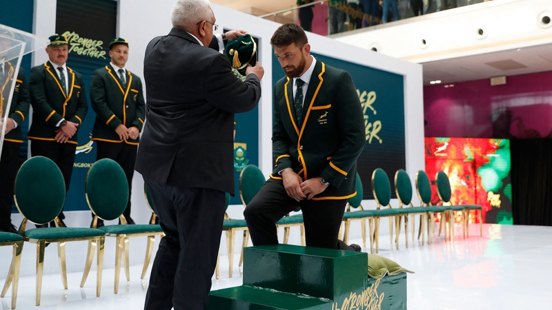 Jean Kleyn receives a cap from Mark Alexander, South African Rugby Union president